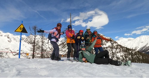 Action Outdoors ski season winter 23/24 team pose on the slopes for a photo