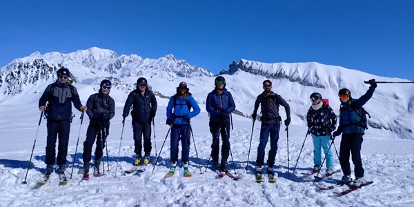 UCPA trip ski touring group pose on the slopes of Les Contamines